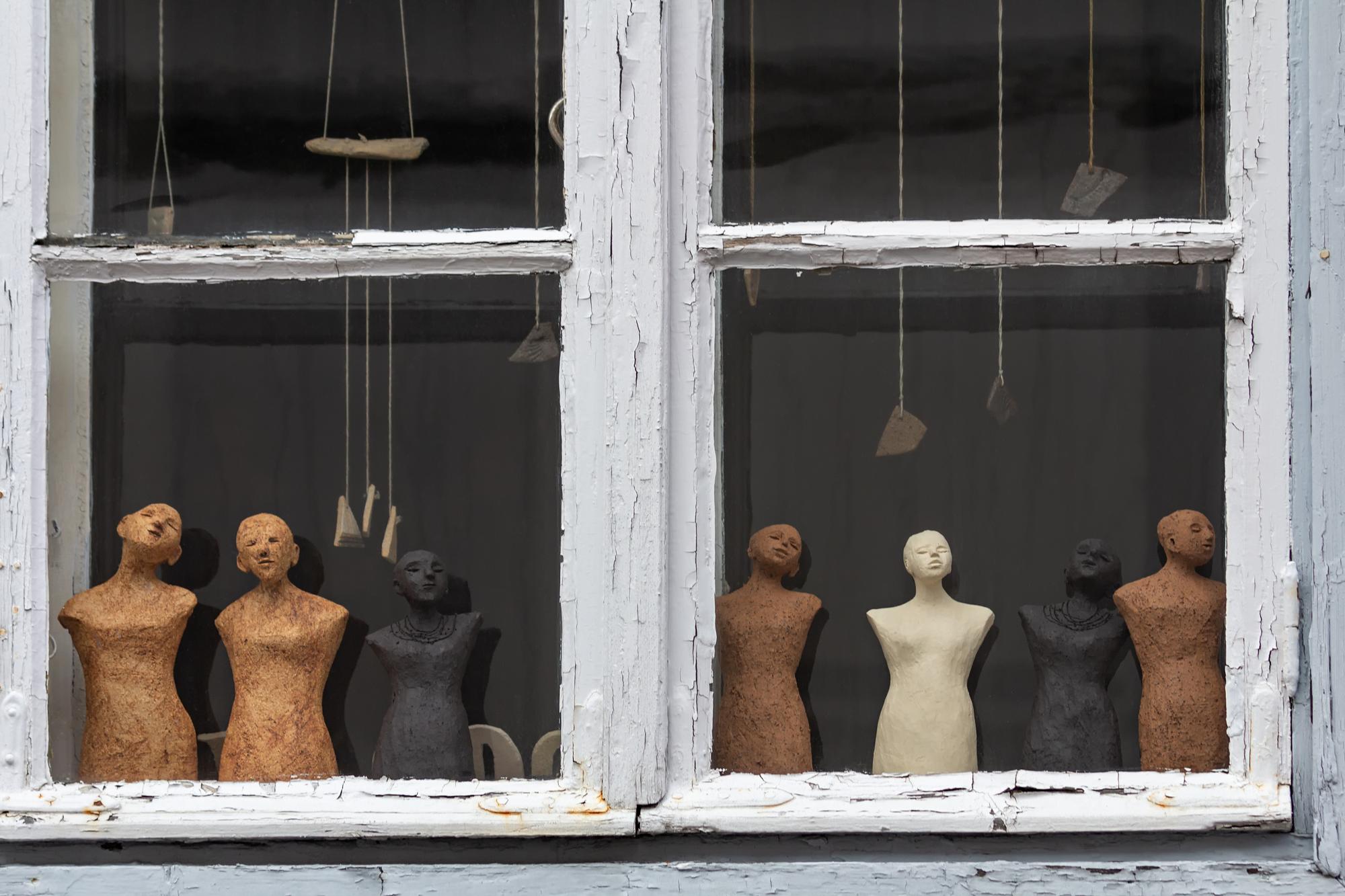 studio entrance and window with hanging textiles
